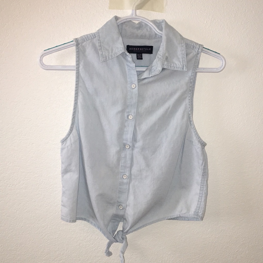 Denim shirt with buttons and a tie at the bottom